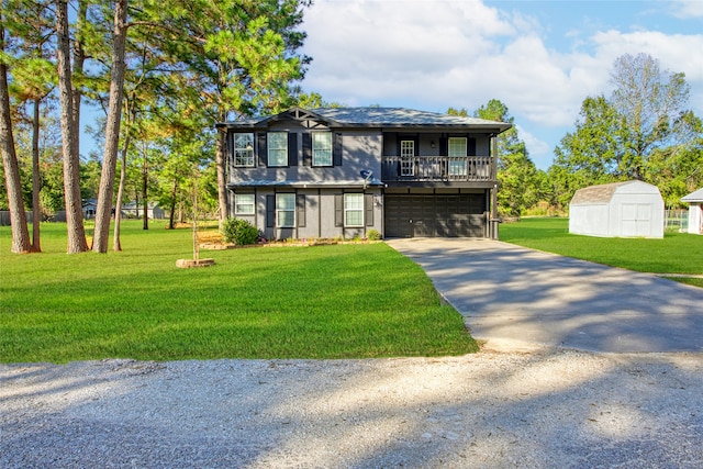 view of front of property featuring a garage, a front lawn, and a storage shed