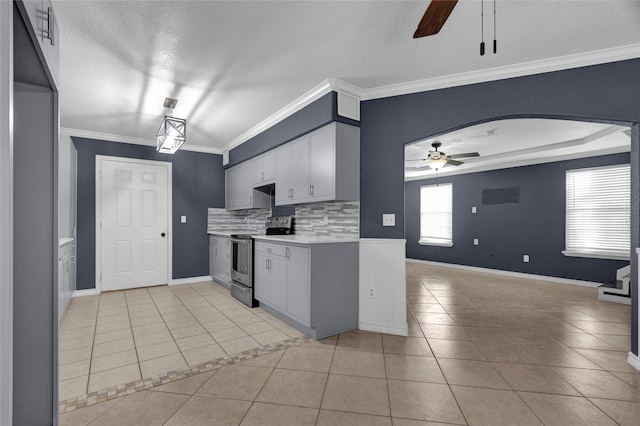 kitchen featuring ornamental molding, backsplash, a textured ceiling, light tile patterned floors, and electric range