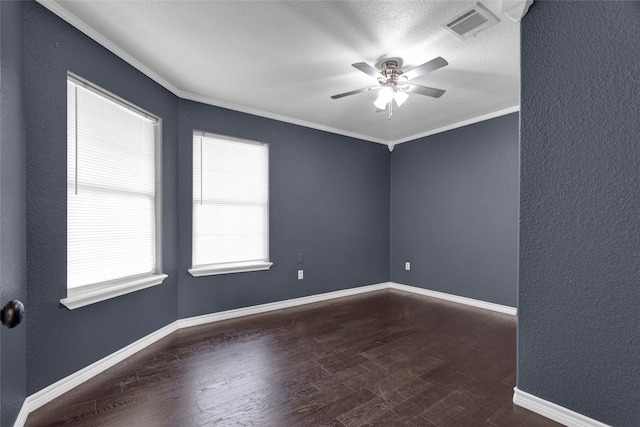 spare room with ceiling fan, crown molding, and dark hardwood / wood-style flooring