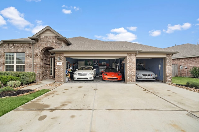 view of front of home featuring brick siding, an attached garage, concrete driveway, and a shingled roof