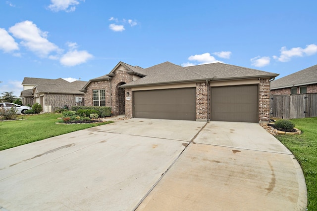 view of front of house featuring a garage and a front yard