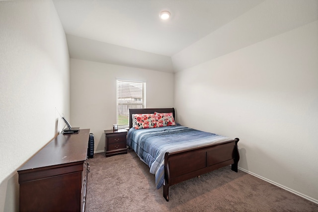 carpeted bedroom featuring lofted ceiling