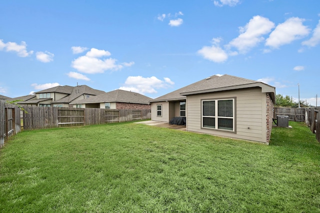 back of property featuring a lawn, central AC, and a patio area