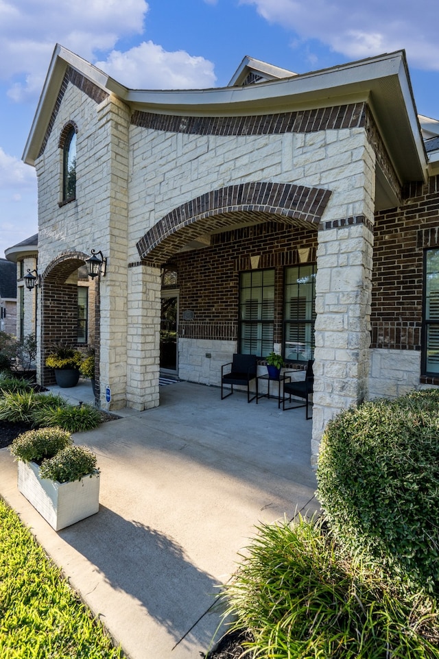 view of property's community with a patio