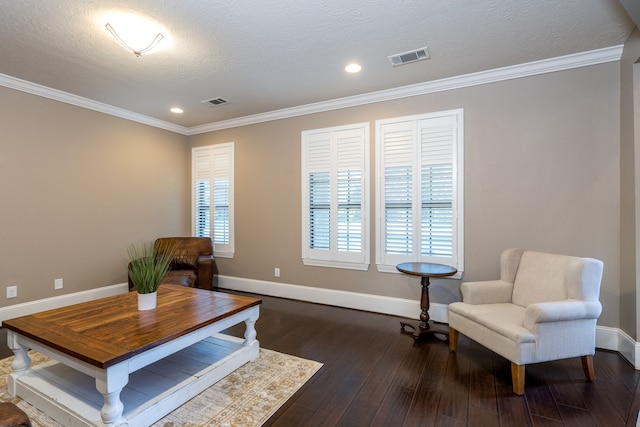 living area featuring a textured ceiling, crown molding, and dark wood-type flooring