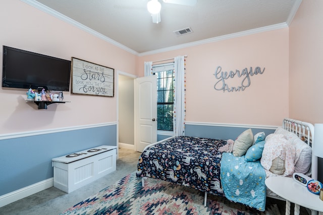 carpeted bedroom featuring ceiling fan and ornamental molding