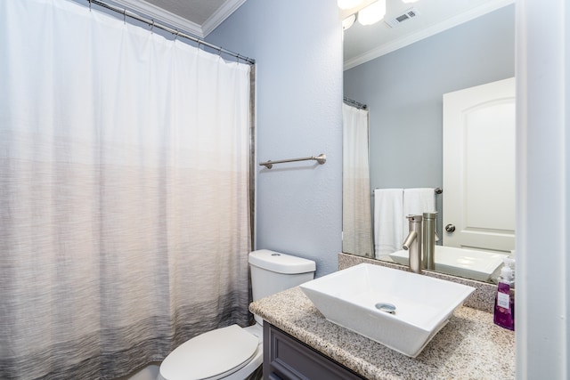 bathroom with vanity, toilet, and crown molding