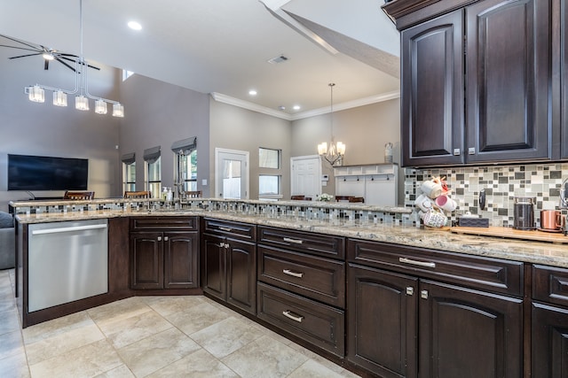 kitchen with stainless steel dishwasher, decorative light fixtures, and dark brown cabinets