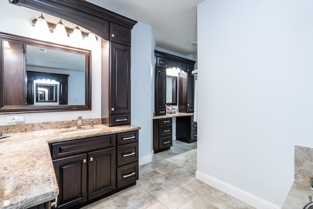 bathroom featuring tile patterned flooring and vanity