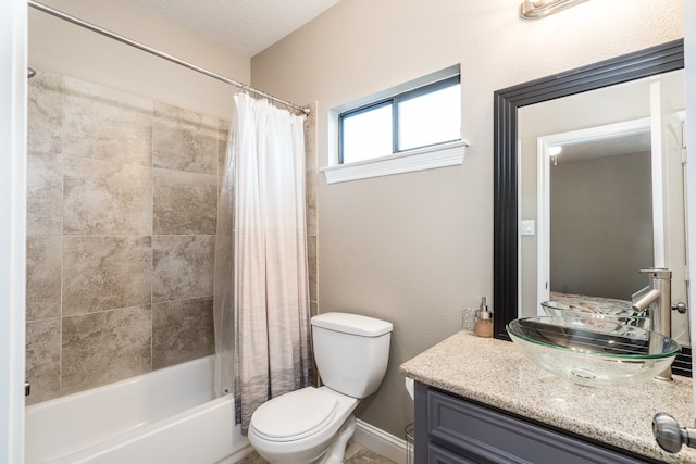 full bathroom featuring a textured ceiling, vanity, toilet, and shower / bath combo with shower curtain