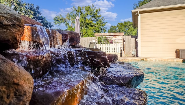 exterior details with a pool