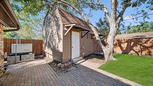 view of outbuilding featuring a yard