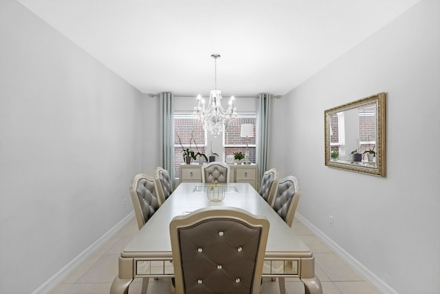 dining area featuring a wealth of natural light, light tile patterned floors, and an inviting chandelier