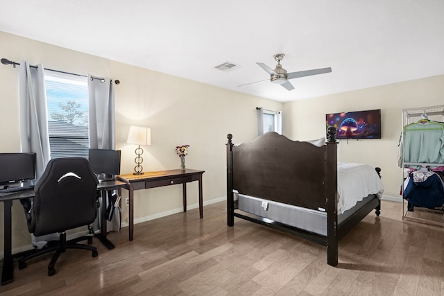 bedroom with hardwood / wood-style flooring and ceiling fan