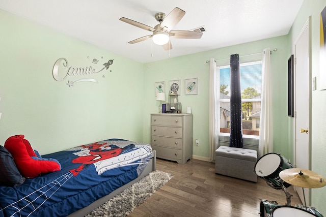 bedroom with hardwood / wood-style floors and ceiling fan