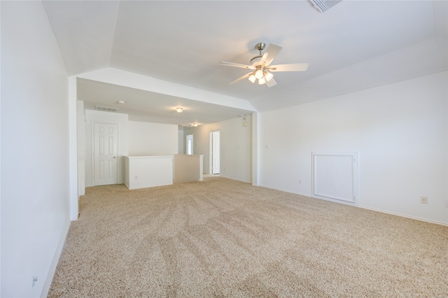 unfurnished living room featuring light colored carpet, lofted ceiling, and ceiling fan