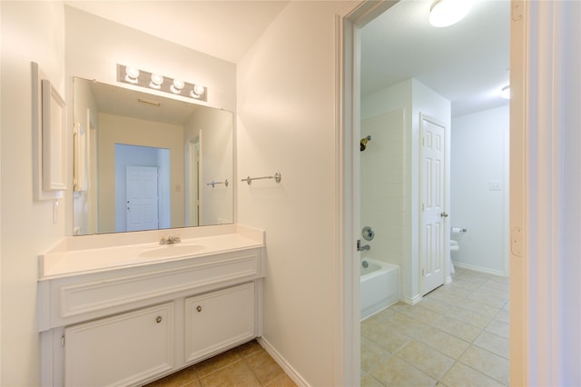 full bathroom with tile patterned flooring, washtub / shower combination, vanity, and toilet