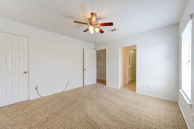 interior space featuring plenty of natural light and ceiling fan