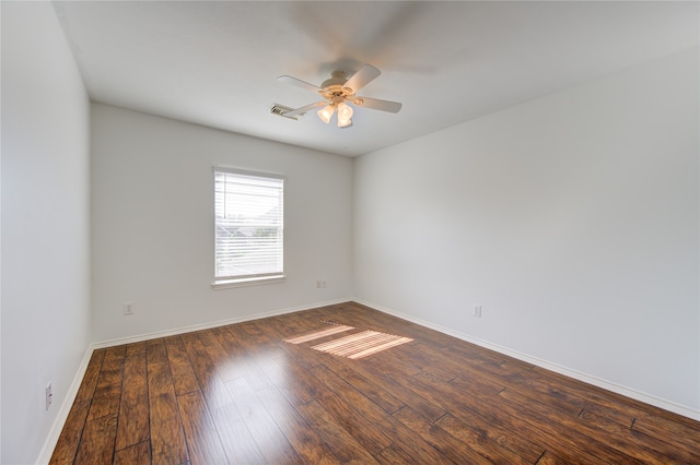 unfurnished room featuring ceiling fan and dark hardwood / wood-style flooring