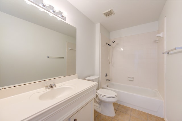 full bathroom featuring toilet, vanity, tiled shower / bath combo, and tile patterned floors