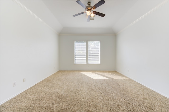 unfurnished room with vaulted ceiling, carpet flooring, and crown molding