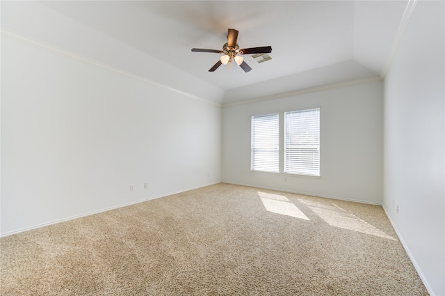 carpeted spare room with ceiling fan, crown molding, and lofted ceiling