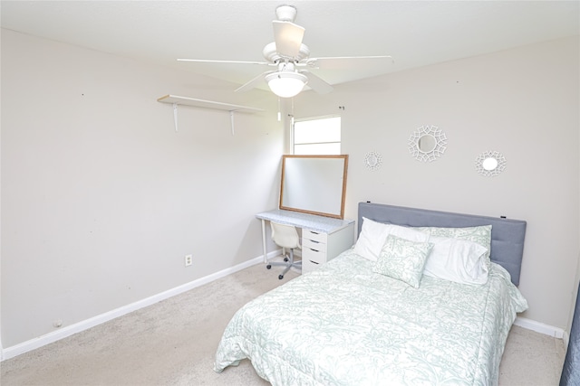 bedroom featuring light carpet and ceiling fan