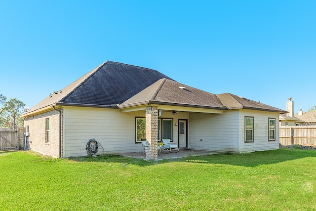 back of house with a patio, a yard, and ceiling fan