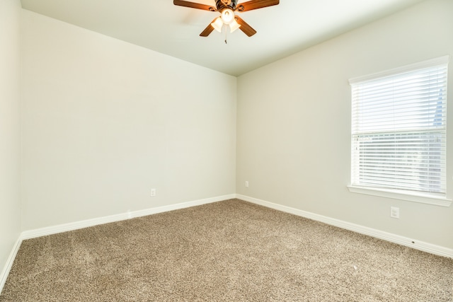 carpeted empty room featuring ceiling fan