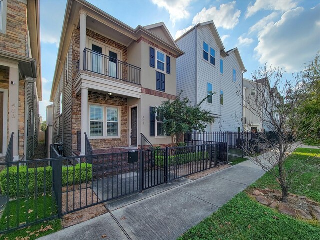 multi unit property featuring a balcony