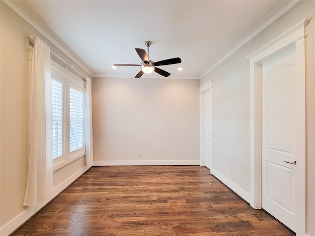 empty room featuring crown molding, ceiling fan, and dark hardwood / wood-style flooring