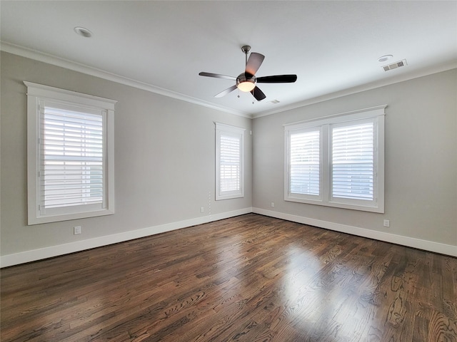 empty room featuring crown molding, ceiling fan, and dark hardwood / wood-style flooring