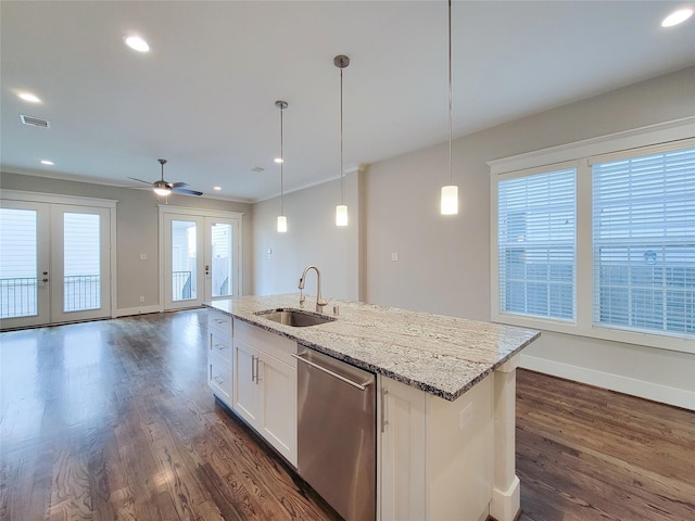 kitchen featuring decorative light fixtures, dishwasher, sink, white cabinets, and french doors