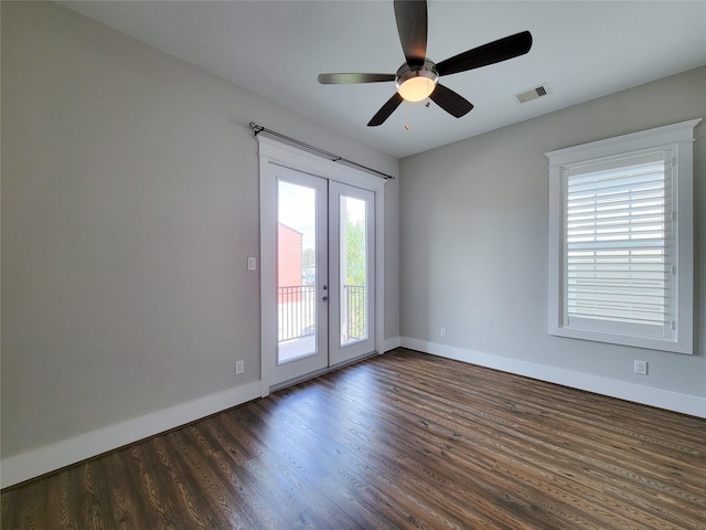 unfurnished room with dark hardwood / wood-style floors, french doors, and ceiling fan