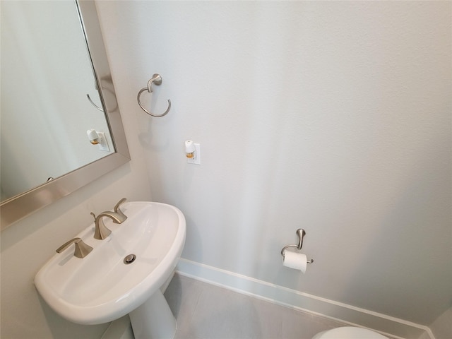 bathroom featuring tile patterned flooring and sink