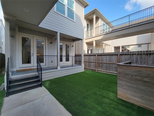 view of yard featuring french doors