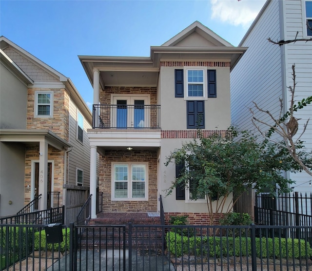 view of front of property with a balcony