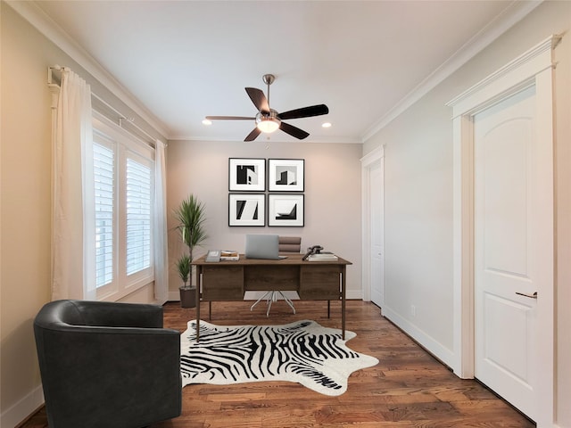 home office featuring dark wood-type flooring, ornamental molding, and ceiling fan