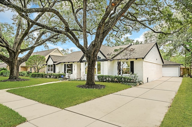 view of front facade with a front lawn and a garage