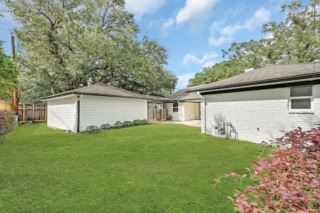 rear view of house with a yard