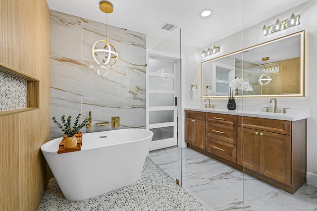 bathroom featuring a bath, vanity, and tile walls