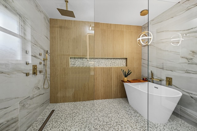 bathroom featuring tile walls and shower with separate bathtub