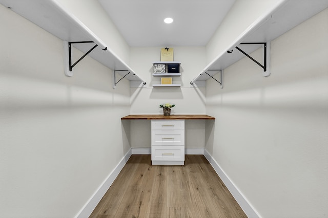 spacious closet with light hardwood / wood-style floors