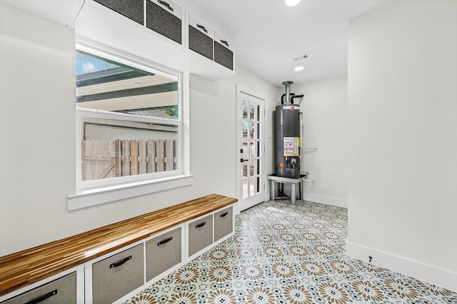 mudroom featuring water heater