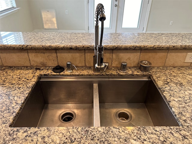 room details with stone counters and sink