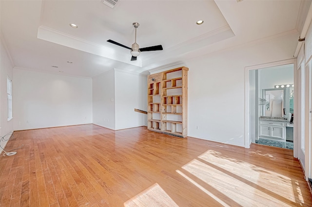 5031 Nolda St, Houston, TX 77007 - spare room featuring a raised ceiling, recessed lighting, light wood-style floors, ceiling fan, and ornamental molding