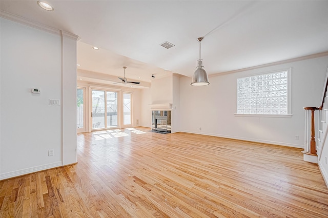 unfurnished living room with ceiling fan, light hardwood / wood-style flooring, and ornamental molding