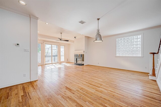5031 Nolda St, Houston, TX 77007 - unfurnished living room with light wood-type flooring, baseboards, visible vents, a multi sided fireplace, and ceiling fan