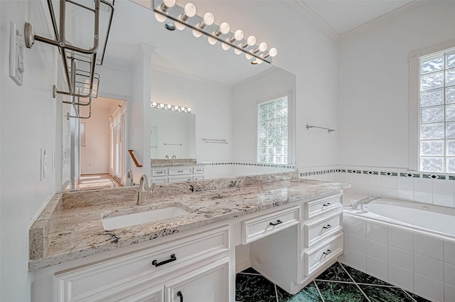 bathroom featuring vanity, a relaxing tiled tub, and crown molding