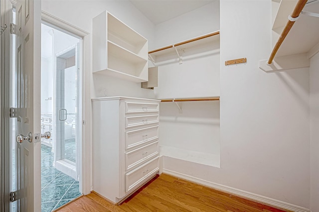 walk in closet featuring light wood-type flooring